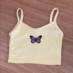 Small yellow crop top with a butterfly design